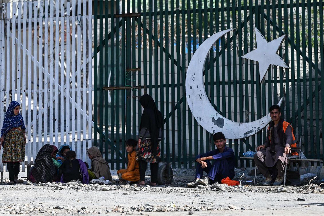 Pushed out of Pakistan where she was born, Nazmine Khan’s first experience of her country, Afghanistan, was in a sweltering tent at a border camp. (AFP)