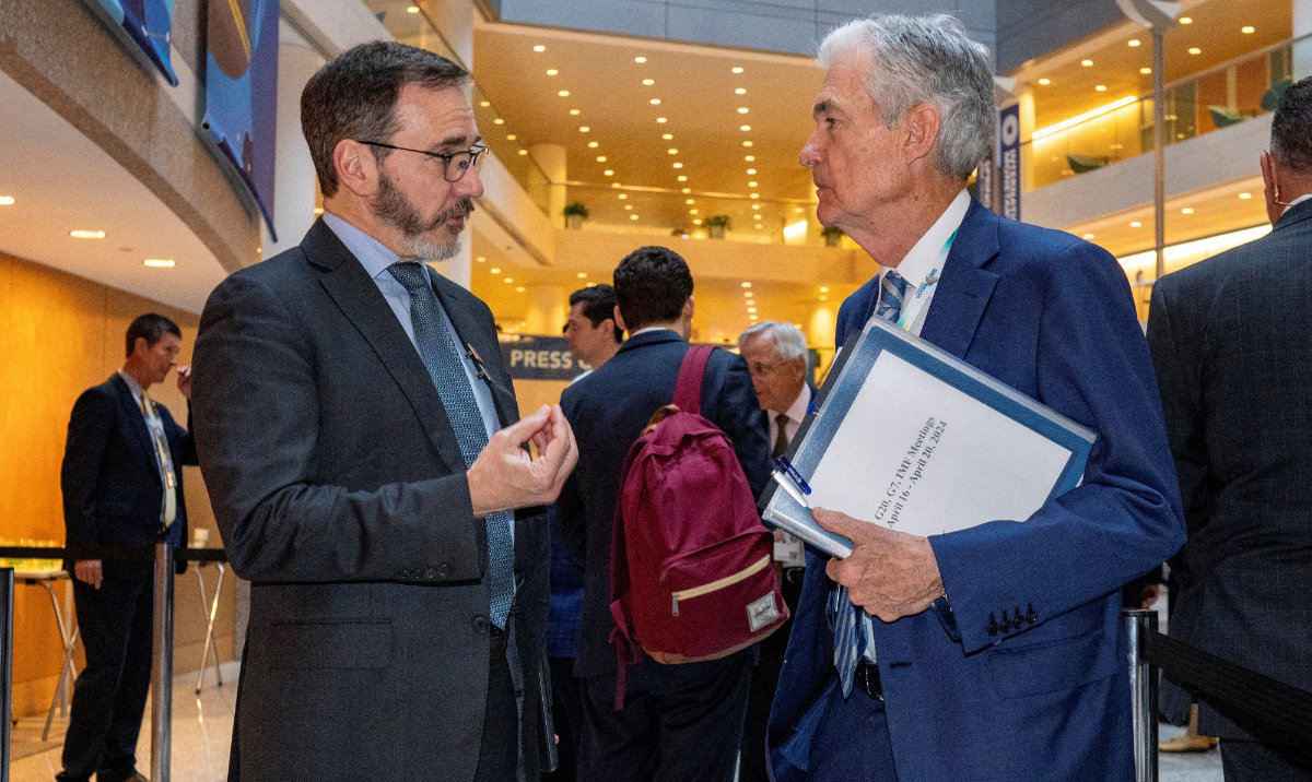 Pierre-Olivier Gourinchas, Chief Economist, International Monetary Fund (left) speaks with Federal Reserve Chair Jerome Powell prior to the start of the International Monetary and Financial Committee (IMFC) plenary session at the IMF and World Bank's 2024 annual Spring Meetings in Washington, US, April 19, 2024. (Reuters)