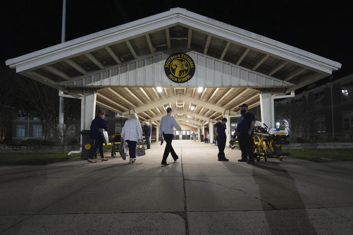 People head into an evacuation shelter at Southern Regional High School from wildfires on April 22, 2025, near Stafford Township, New Jersey. (AP)