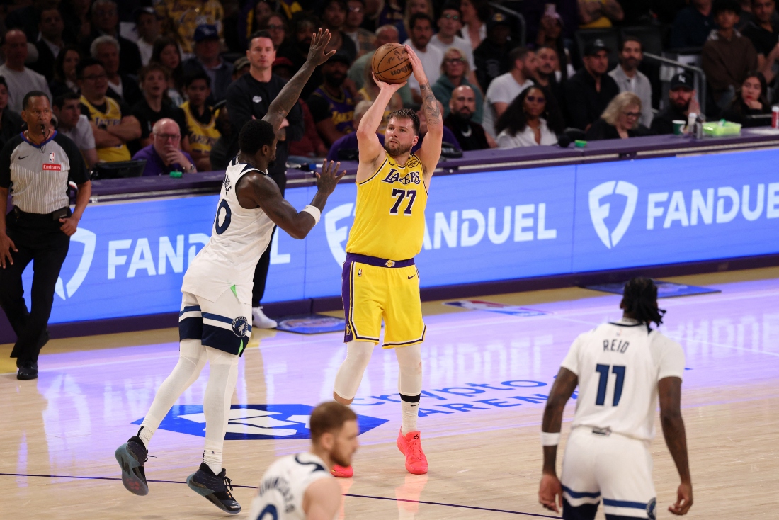 Los Angeles Lakers guard Luka Doncic shoots the ball over Minnesota Timberwolves forward Julius Randle during the third quarter of Game 2 of the 2024 NBA Playoffs firsts round at Crypto.com Arena Tuesday. (Kiyoshi Mio-Imagn Images)
