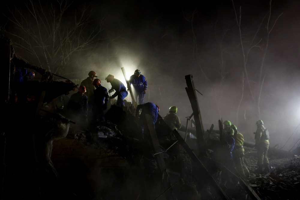 Rescuers work at the site of an apartment building hit by a Russian ballistic missile strike, amid Russia's attack on Ukraine, in Kyiv, Ukraine April 24, 2025. (Reuters)