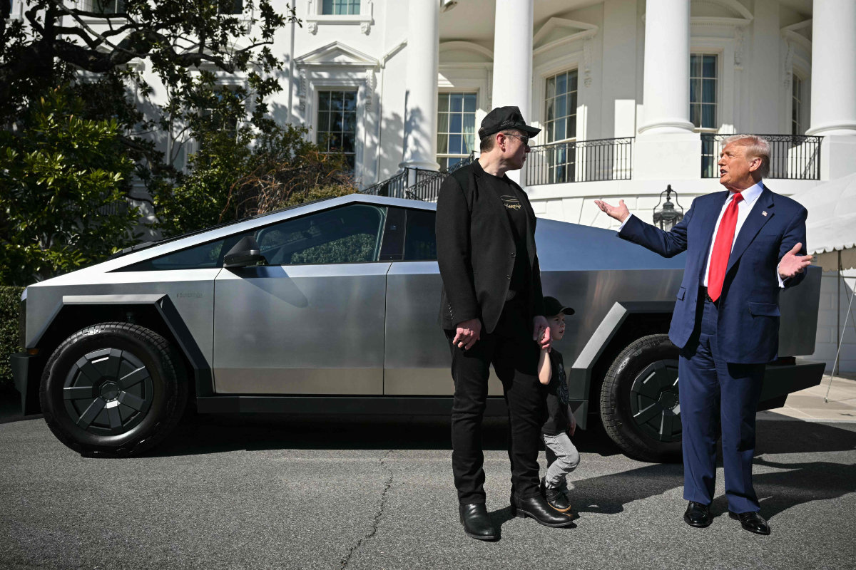 US President Donald Trump and Tesla CEO Elon Musk speak to the press as they stand next to a Tesla Cybertruck on the South Portico of the White House on March 11, 2025 in Washington, DC. (AFP)