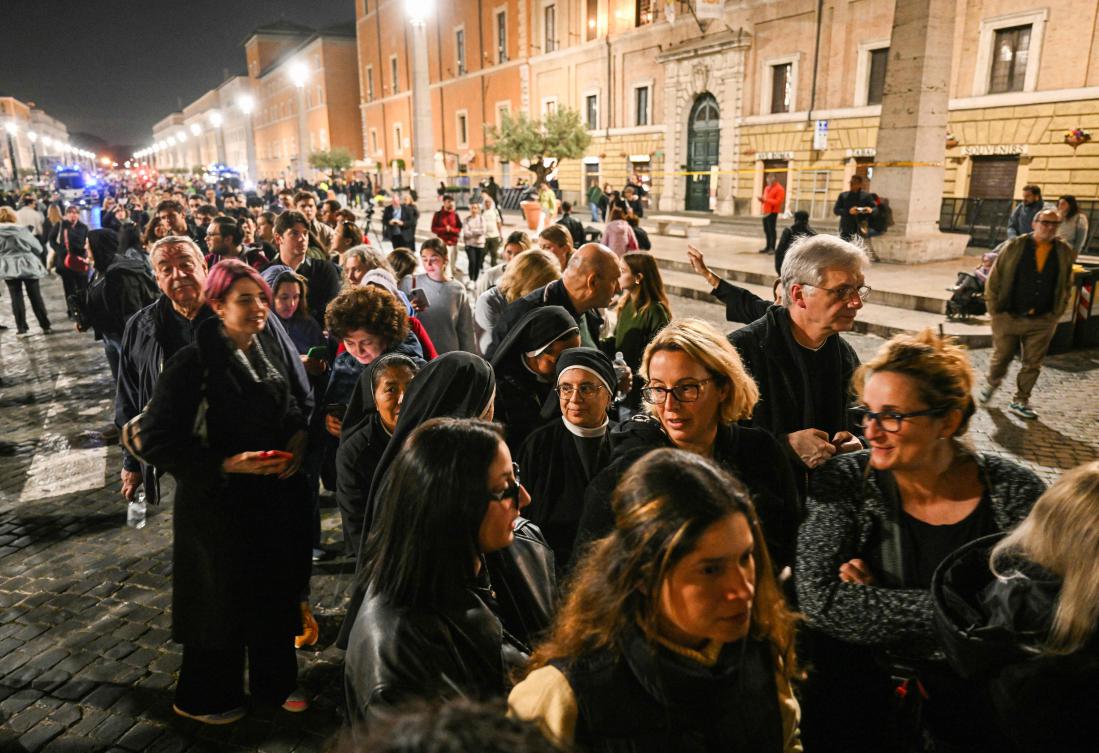 People queue to pay their respects to late Pope Francis as his body lies in state, on Via della Conciliazione, near the Vatican, in Rome, on April 23, 2025. (AFP)