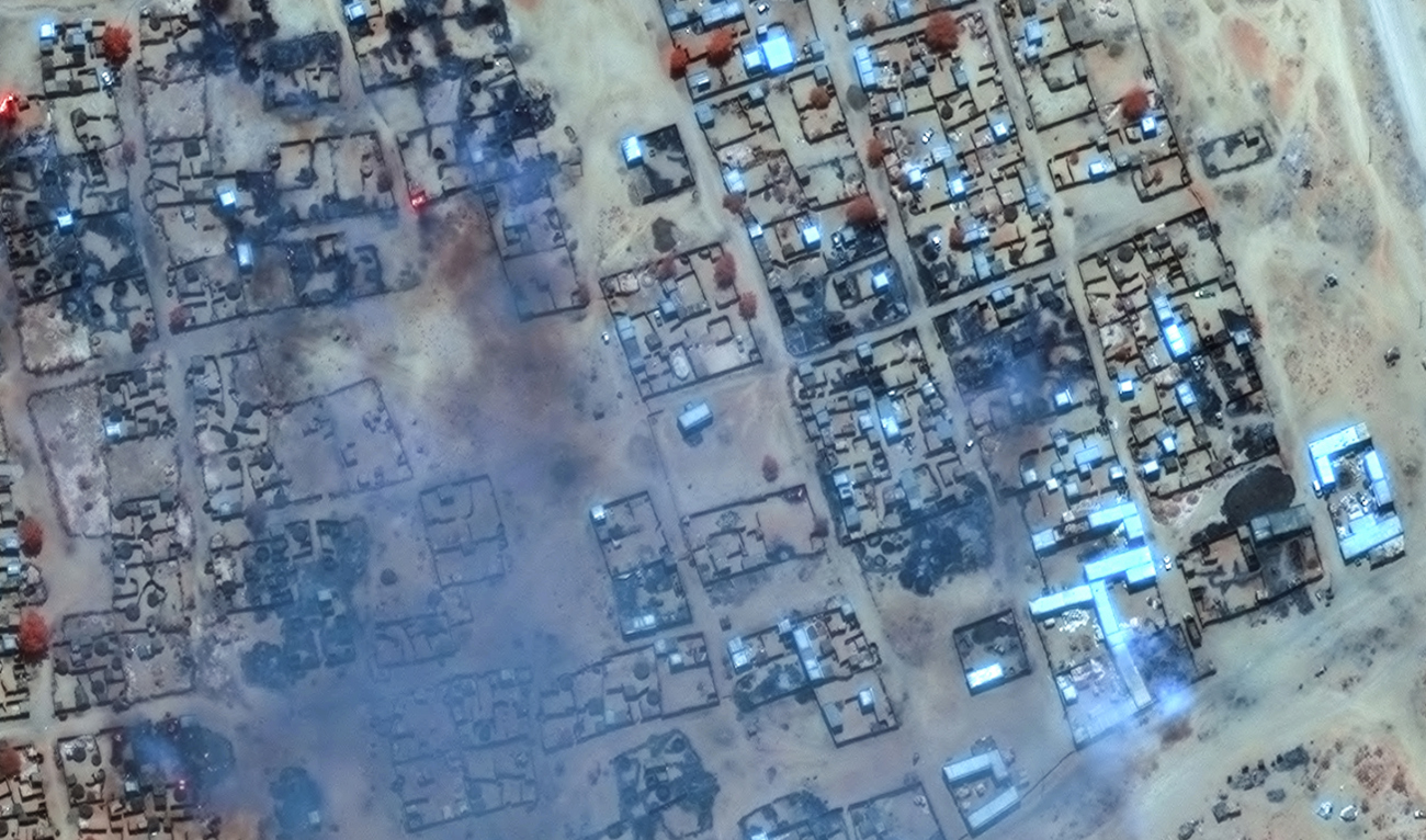 This handout image courtesy of Maxar Technologies released on April 17, 2025, shows smoke billowing and burned buildings in the Zamzam camp near the besieged Darfur city of El-Fasher. (AFP/File)