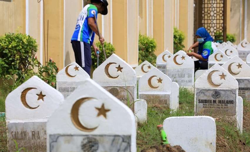 Above, maintenance workers clean Manila Islamic Cemetery’s tombs on Nov. 3, 2022. (Manila Islamic Cemetery)
