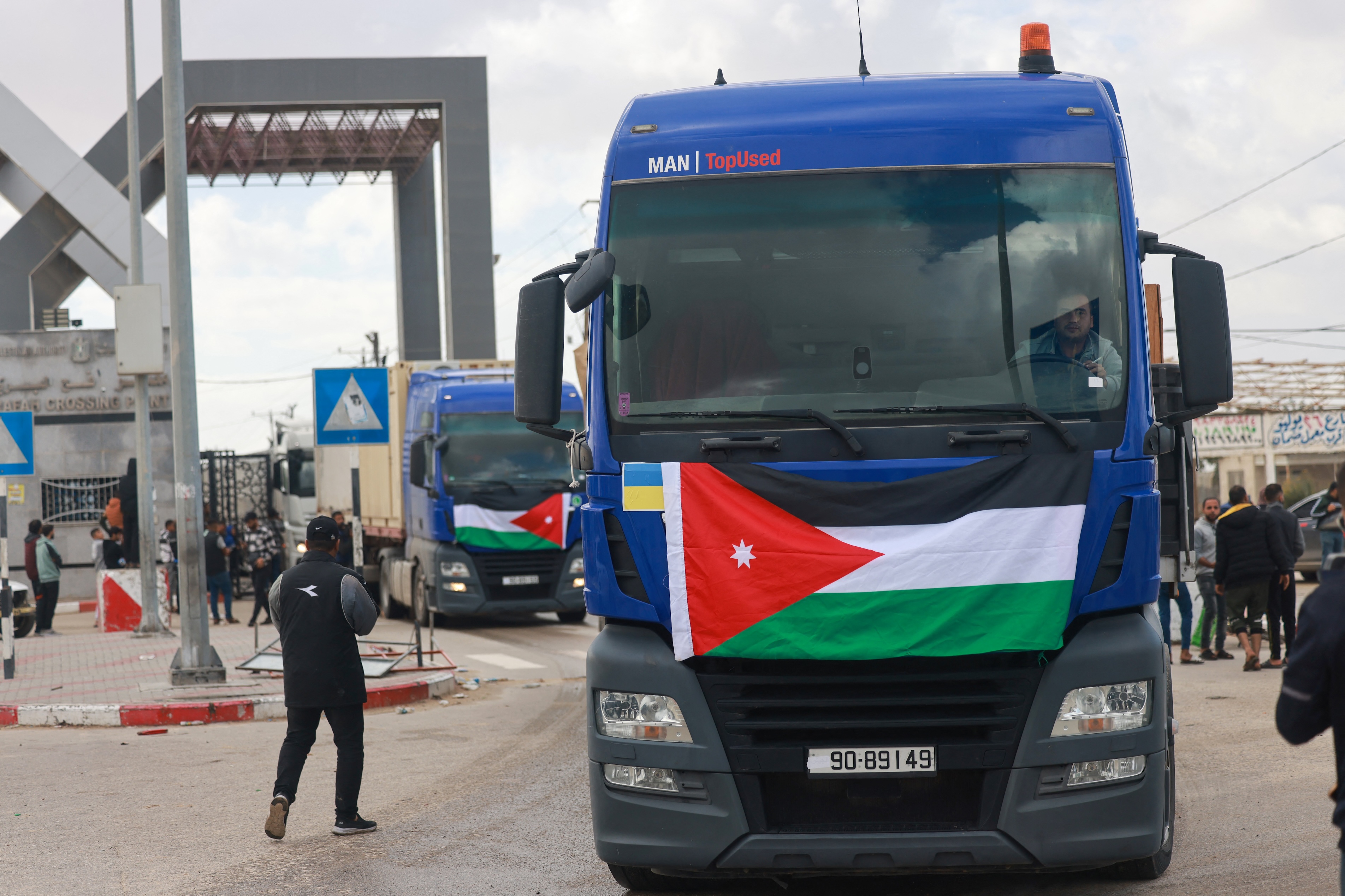 An aid convoy bearing the Jordanian flag enters the Gaza Strip through the Rafah crossing with Egypt. (File/AFP)