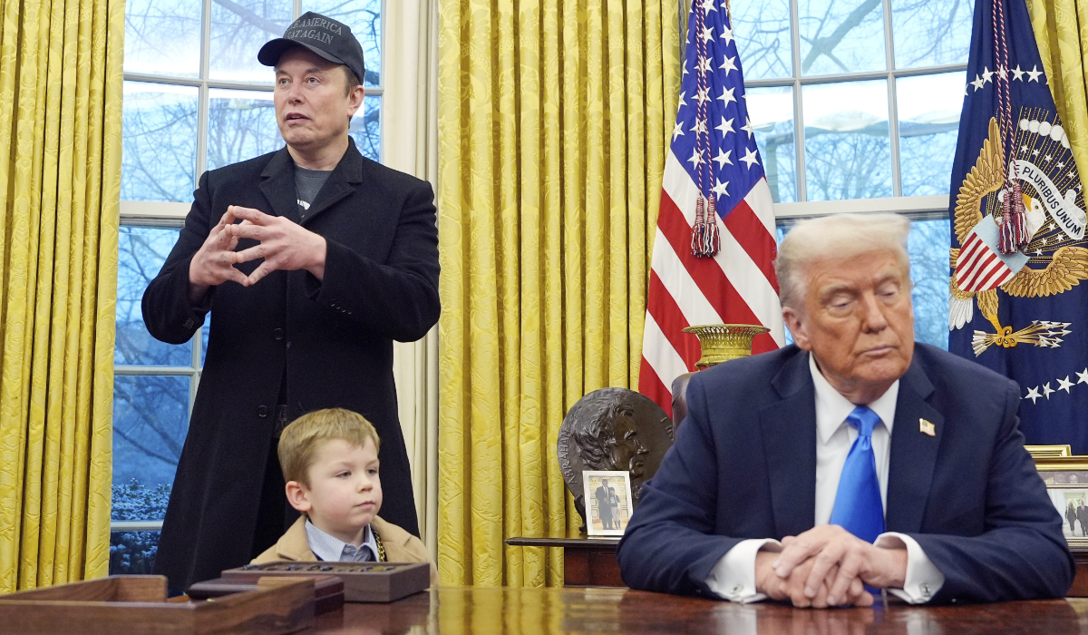 President Donald Trump listens as Elon Musk, joined by his son X Æ A-Xii, speaks in the Oval Office at the White House, Feb. 11, 2025, in Washington. (AP)