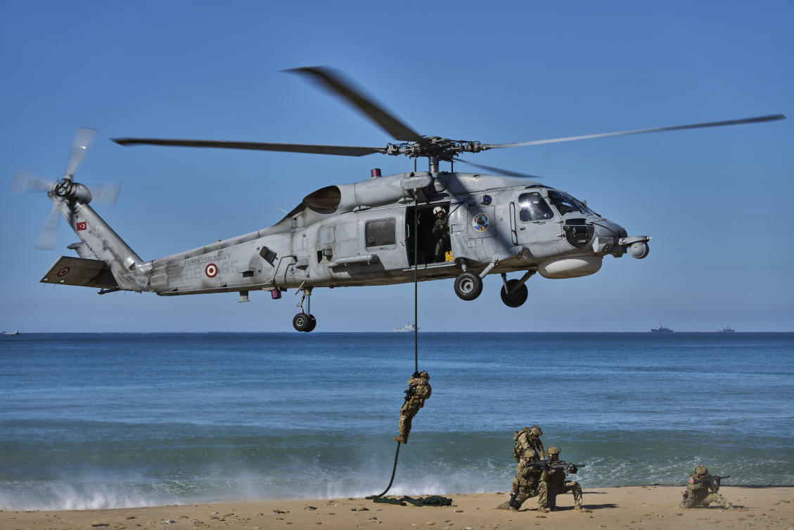 Turkish navy soldiers descend from a Sikorsky helicopter as part of the NATO Dynamic Mariner/Flotex-25 naval exercise in Barbate, southern Spain, on March 28, 2025. (AP)