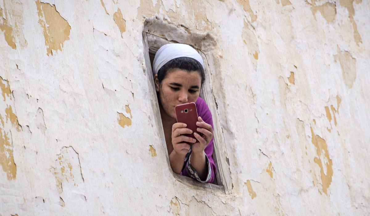 A Moroccan woman uses her mobile phone in the capital Rabat. (AFP file photo)