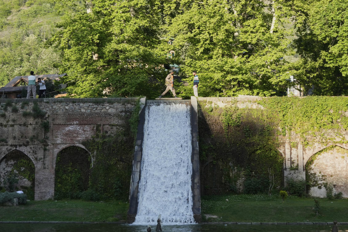 An Indian paramilitary soldier stands guard inside a Mughal garden on the outskirts of Srinagar, Indian controlled Kashmir on April. 27, 2025. (AP)