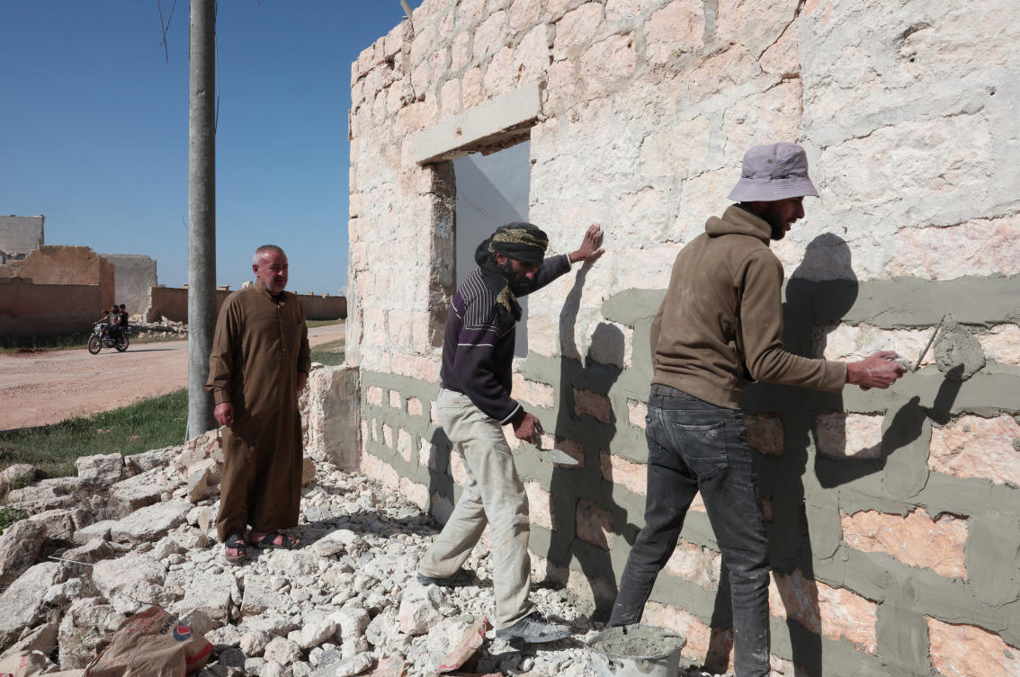 Moussa Hajj Khalil watches as the workers are rebuilding his home on Aleppo, Syria, April 19, 2025. (REUTERS)