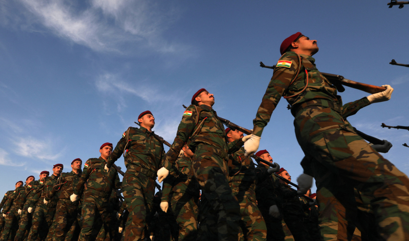 Peshmerga soldiers take part in a graduation ceremony in Arbil, the capital of Iraq’s northern autonomous Kurdish region, on December 3, 2024. (AFP/File)