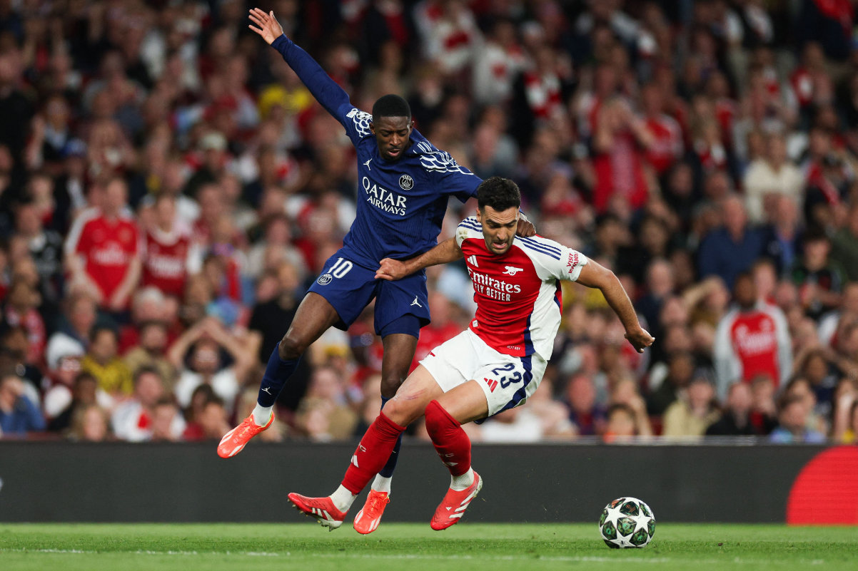 Paris Saint-Germain's French forward #10 Ousmane Dembele (L) fights for the ball with Arsenal's Spanish midfielder #23 Mikel Merino during the UEFA Champions League Semi-final First Leg football match between Arsenal and Paris Saint-Germain (PSG) at the Emirates Stadium in north London, on April 29, 2025. (AFP)