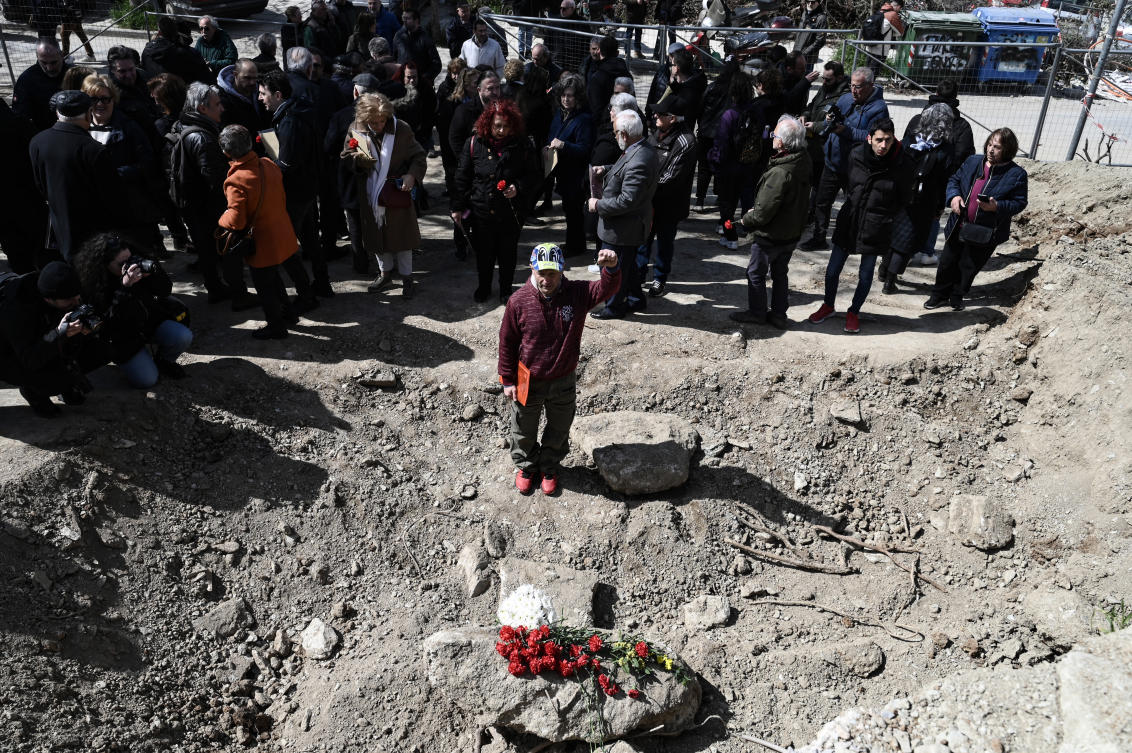Α member of the Communist Party of Greece reacts at the site of two discovered mass graves, containing the remains of executed individuals during the Civil War. (File/AFP)