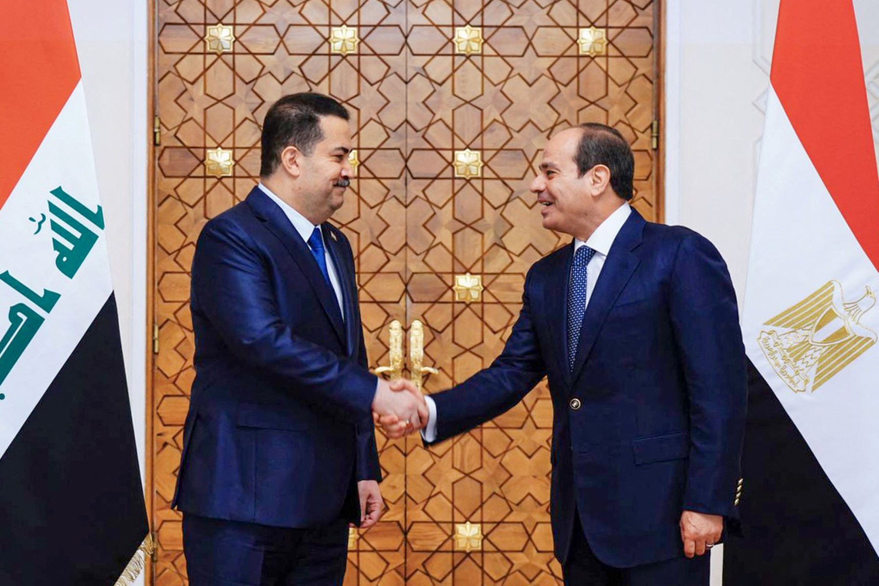 Egyptian President Abdel Fattah al-Sisi (R) receiving Iraqi Prime Minister Mohamed Shia al-Sudani in Cairo on June 13, 2023. (File/AFP)