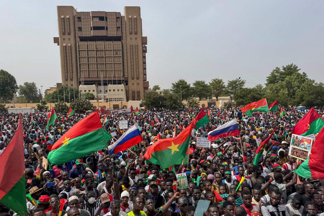 Supporters of Burkina Faso’s junta leader Captain Ibrahim Traore wave flags during a rally in support of Traore at Place de la Nation Ouagadougou on April 30, 2025. (AFP)