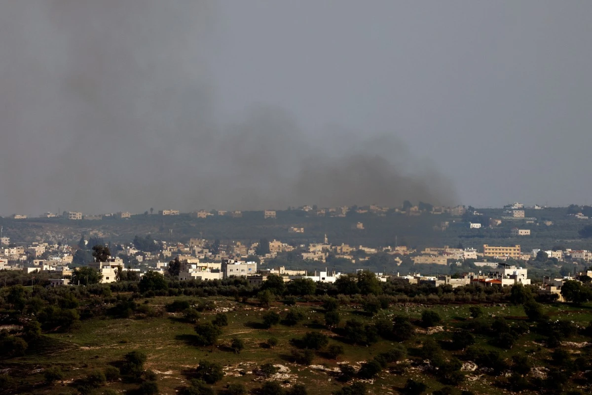 This picture taken from Israel-annexed Golan Heights along the border with southern Syria shows smoke billowing above the Syrian village of Koayiah during Israeli bombardment, on March 25, 2025 (AFP)