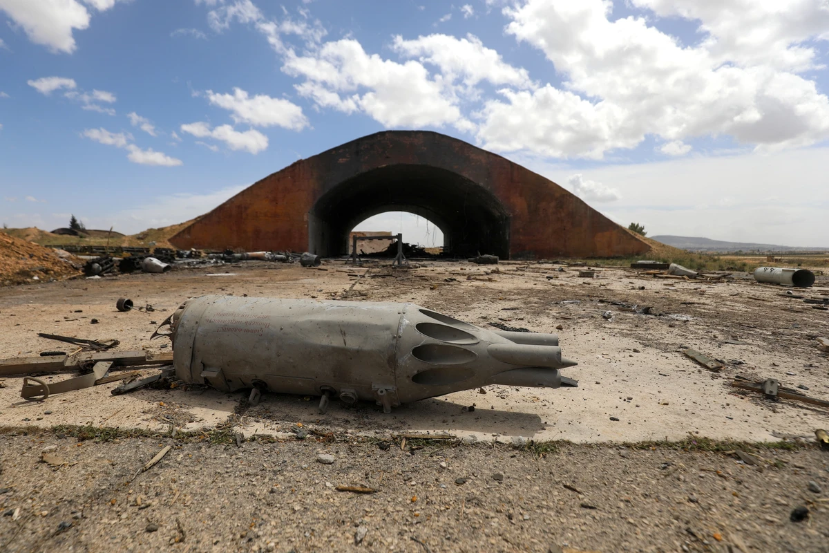Debris lie on the ground at the scene of an Israeli strike in a military facility in Syria's southern Hama governorate, Apr. 3, 2025. (AFP)