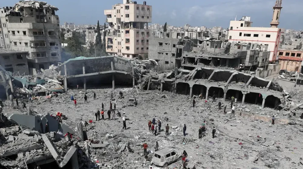 Palestinians inspect the damage at the Dar Al-Arqam school, where displaced people shelter, after it was hit by an Israeli strike on Thursday, in Gaza City, April 4, 2025. (Reuters)