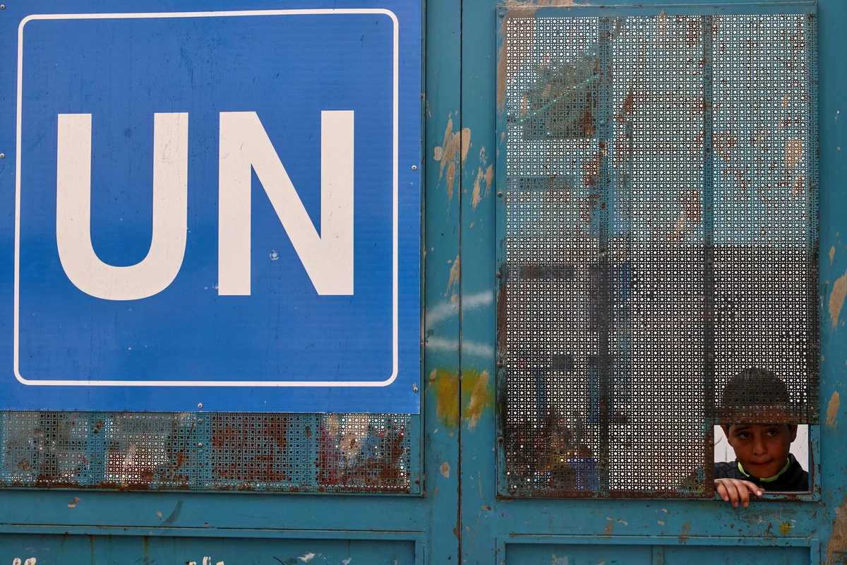 A Palestinian child looks on at a United Nations Relief and Works Agency for Palestine Refugees (UNRWA) run school in the Qalandia refugee camp, north of Jerusalem, Nov. 14, 2024. (AFP)