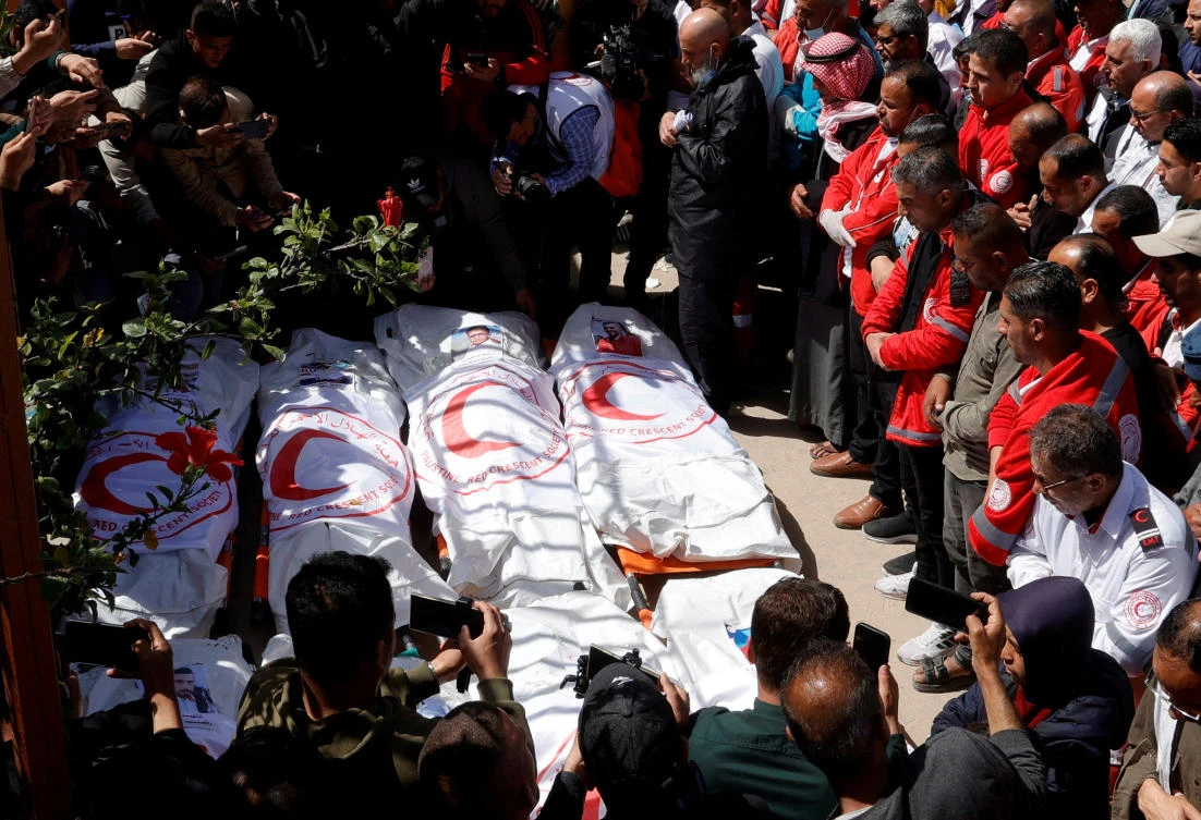 Palestinians mourn medics killed by Israel while on a rescue mission in Gaza. (Reuters)