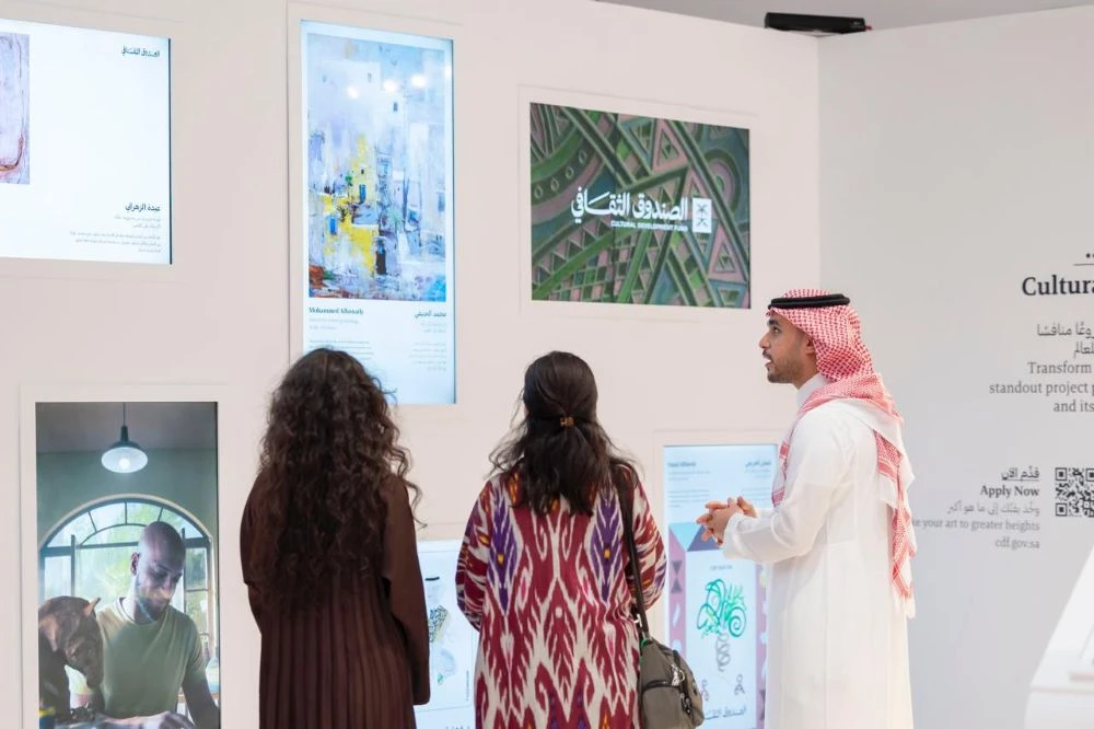 Visitors admire the artworks at the Saudi Cultural Development Fund’s booth during ART Week Riyadh , which commenced on April 6. (Supplied/CDF)