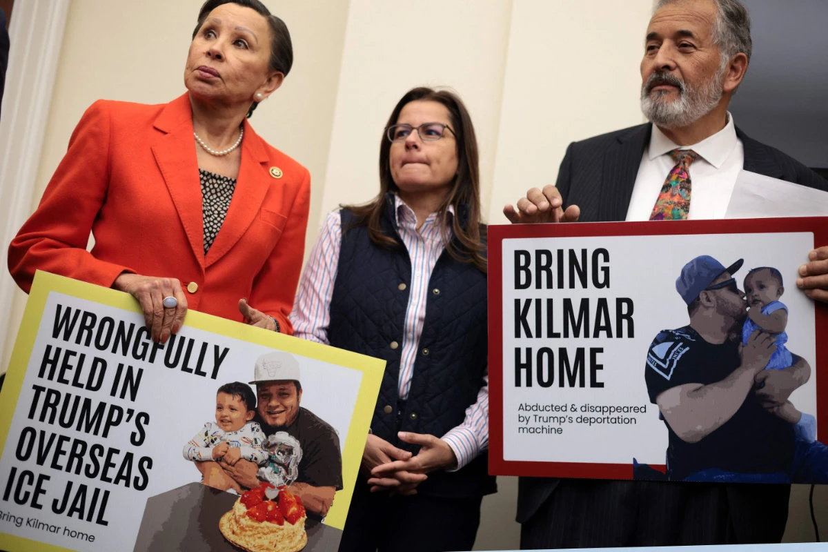 US Rep. Nydia Velazquez (L) and Rep. Juan Vargas (R) hold pictures of Kilmar Abrego Garcia during a news conference to discuss his arrest and deportation to El Salvador by the Trump administration. (Getty Images via AFP)