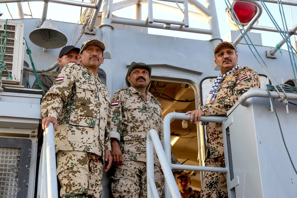 Brig. Gen. Tariq Mohammed Abdullah Saleh, right, a member of Yemen’s Presidential Leadership Council, observes as coastguard members patrol in the Red Sea off Mokha in the western Taiz province on Dec. 12, 2023. (AFP)