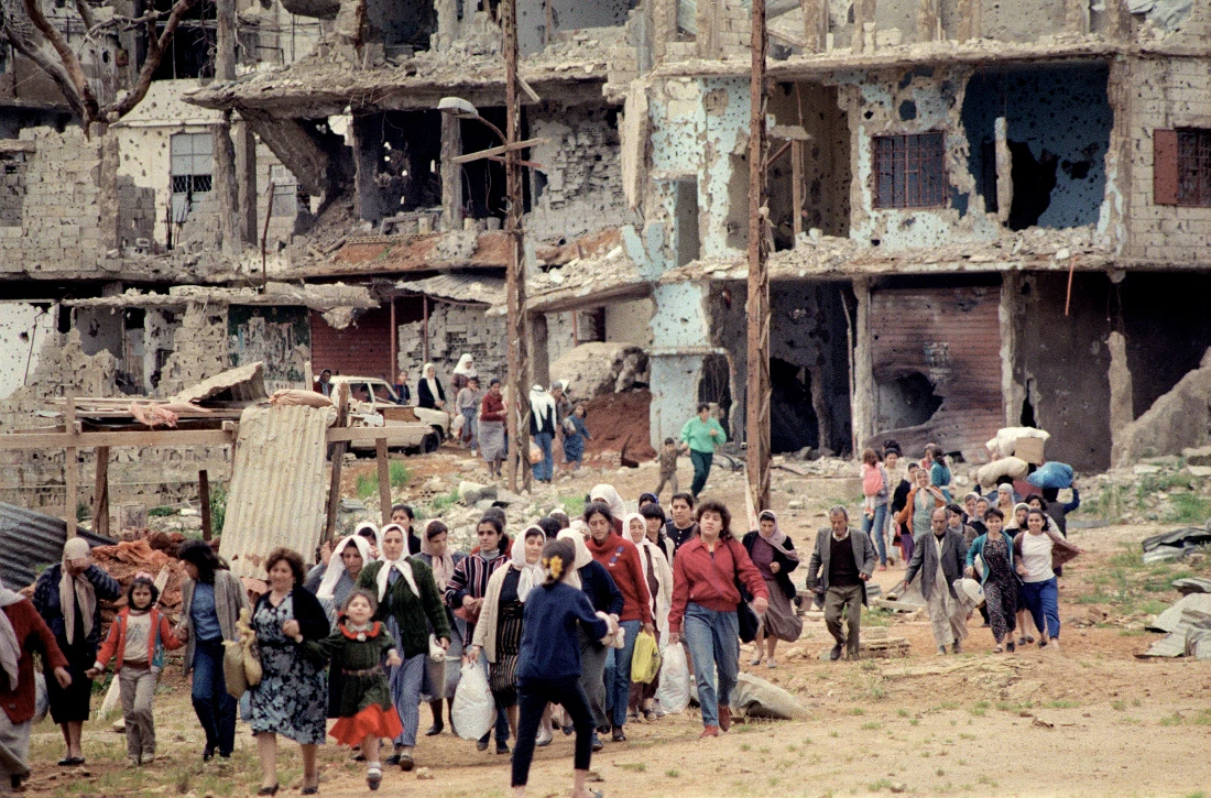 Dozens of Palestinian women leave the Bourj Barajneh refugee camp in Beirut southern suburb 25 March 1987, to look for some food at the nearby market. (File/AFP)