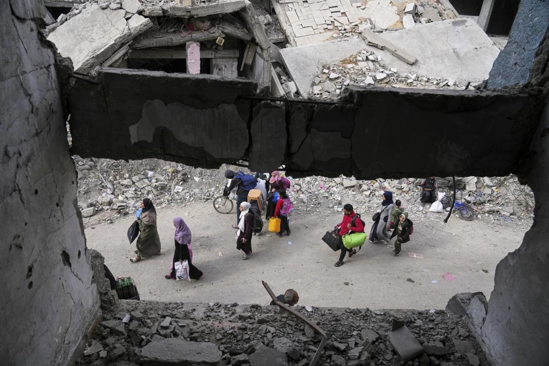 Displaced Palestinians flee from east to west of Gaza City after the Israeli military issued evacuation orders in the area on Friday. (AP)