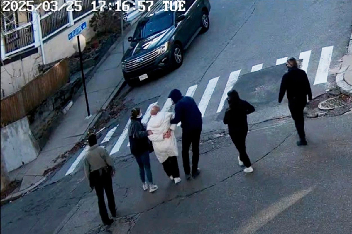 In this image taken from security camera video, Rumeysa Ozturk, a 30-year-old doctoral student at Tufts University, is detained by Department of Homeland Security agents on a street in Sommerville, Massachusetts, on March 25, 2025. (AP Photo)