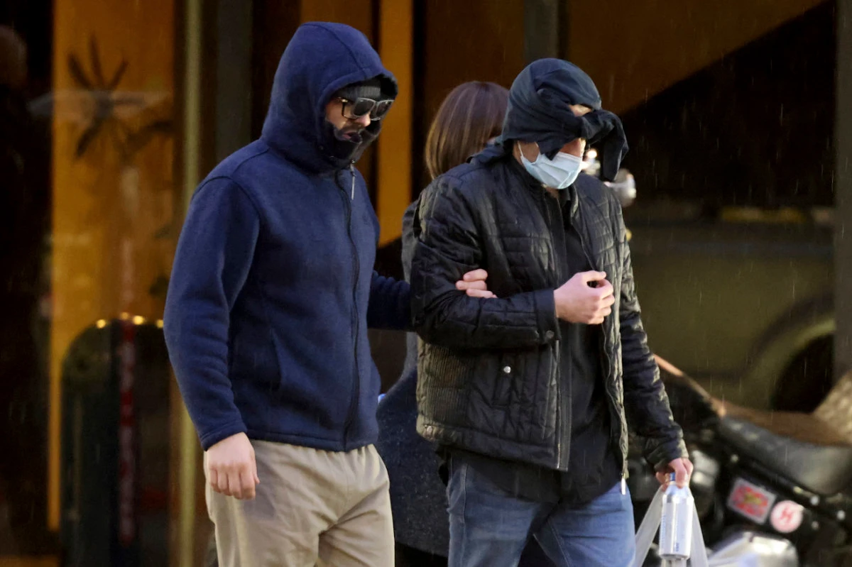 Former FBI informant Alexander Smirnov, left, walks out of his lawyer's office in downtown Las Vegas after being released from federal custody on Feb. 20, 2024. (Las Vegas Review-Journal via AP, File)