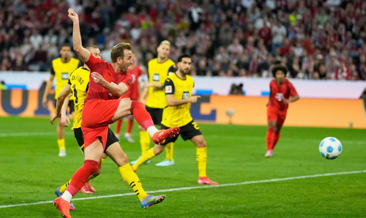 Bayern's Harry Kane makes an attempt to score during the German Bundesliga soccer match between Bayern Munich and Borussia Dortmund at the Allianz Arena in Munich, Germany, Saturday, April 12, 2025. (AP)