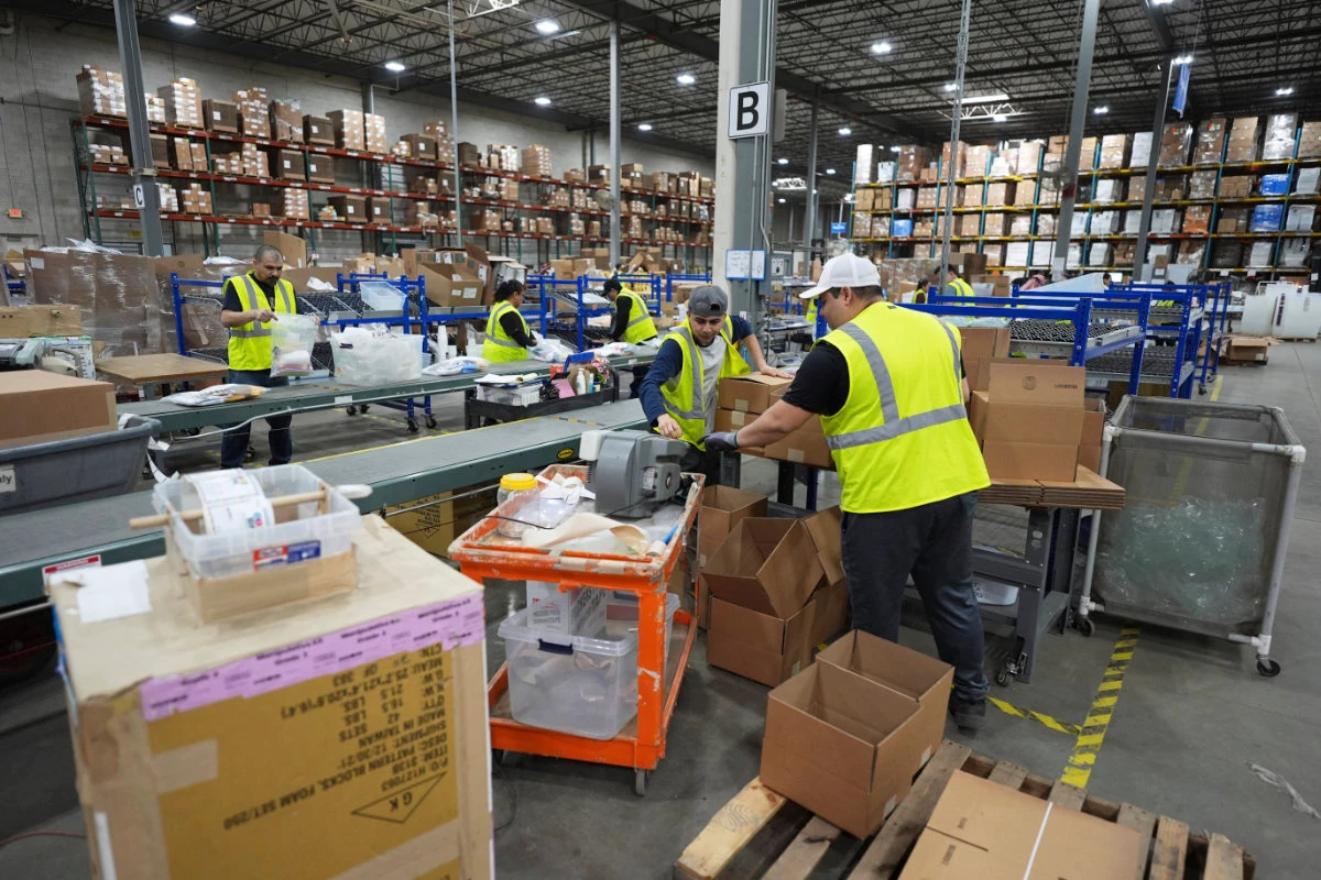 Employees of Learning Resources, an educational toy company, work at a warehouse in Vernon Hills, Illinois, on April 11, 2025. (AP Photo)