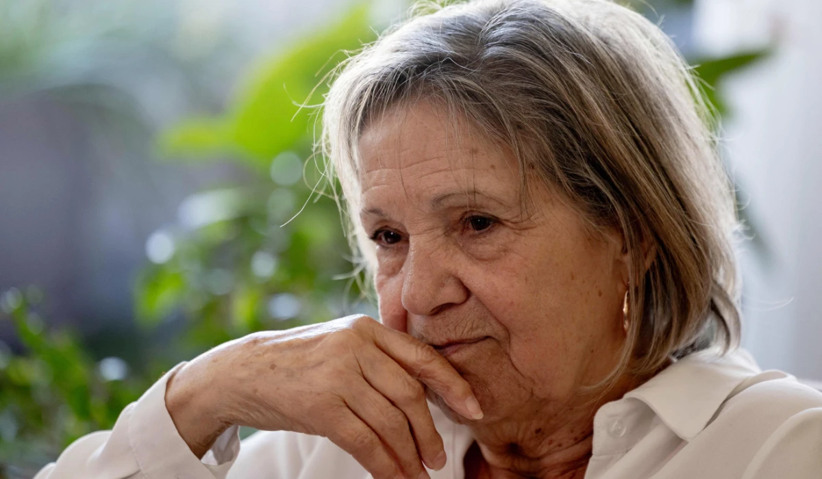 Claudine Spire, 78, pauses during an interview at her home in Chaville, on the outskirts of Paris, on April 9, 2025. (AFP)