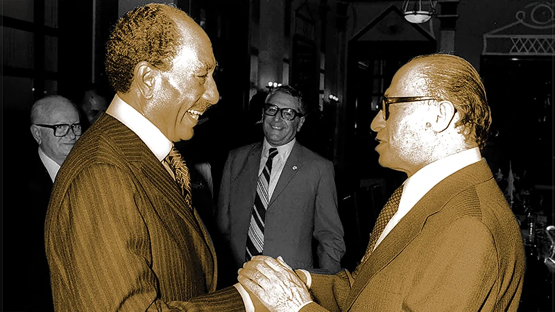 Israeli Prime Minister Menachem Begin receives Egyptian President Anwar Sadat in Jerusalem with a handshake on Nov. 19, 1977. AFP