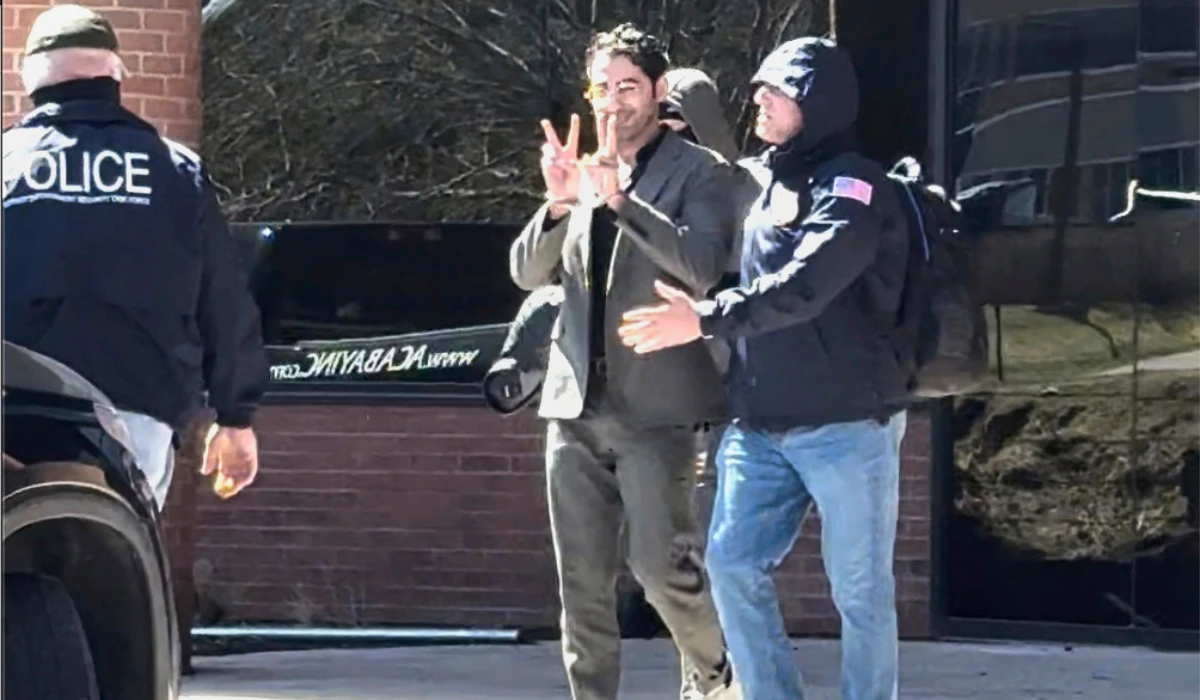 This image taken from a video provided by Christopher Helali shows Mohsen Mahdawi, a Palestinian man who led protests against the war in Gaza as a student at Columbia University, being detained at the U.S. (AP)