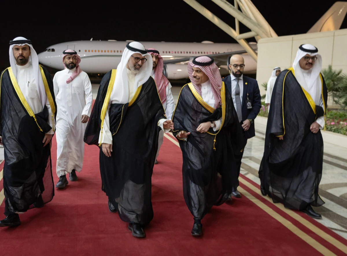 Saudi Foreign Minister Prince Faisal bin Farhan is greeted on arrival in Kuwait on Tuesday. (SPA)