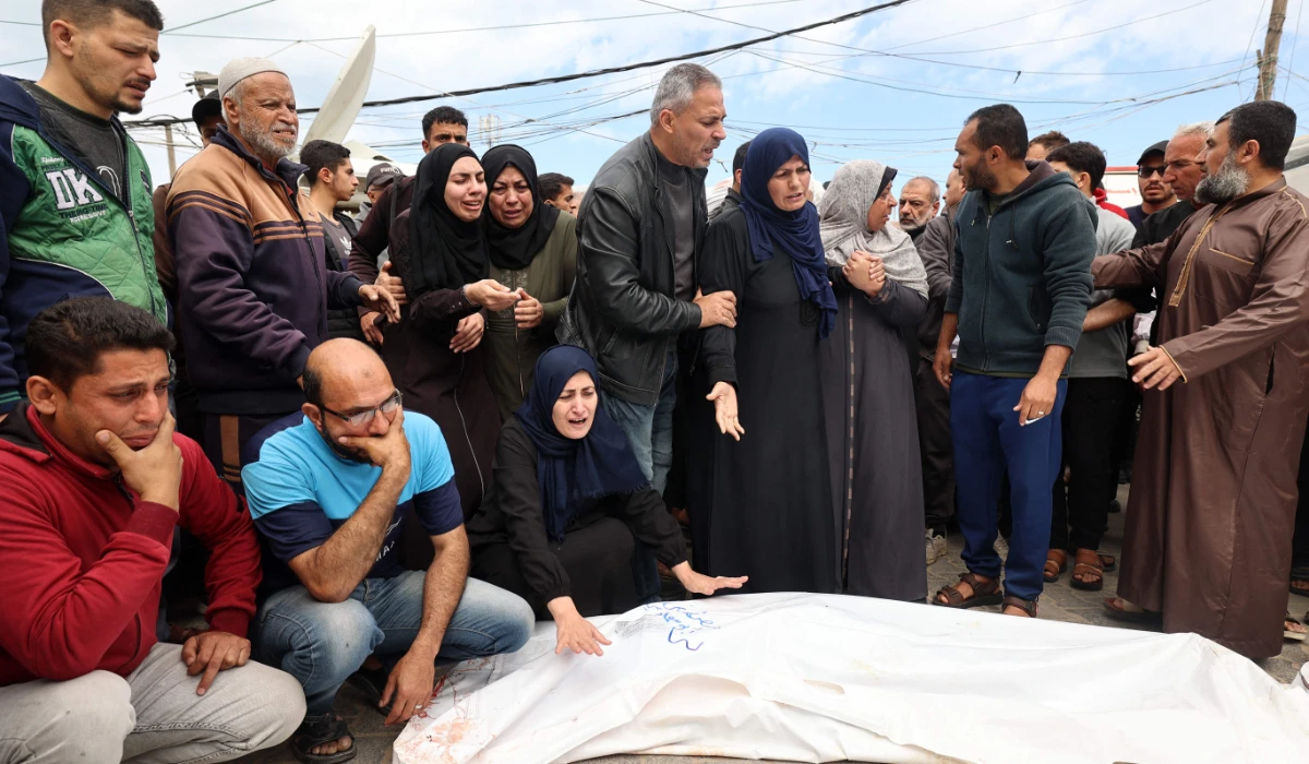 elatives mourn over the bodies of Palestinians killed in an Israeli strike, at the al-Aqsa Martyrs hospital in Deir el-Balah in the central Gaza Strip on April 13, 2025. (AFP)