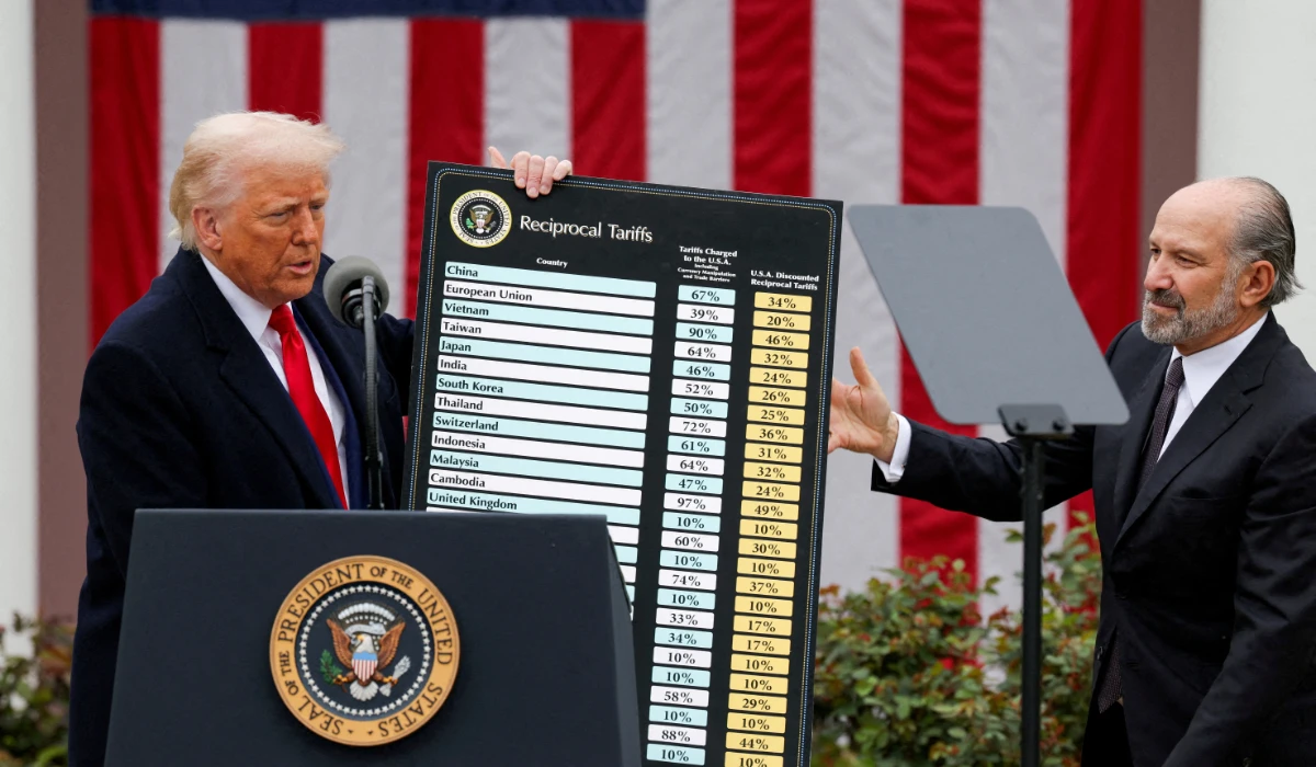U.S. President Donald Trump holds a chart next to U.S. Secretary of Commerce Howard Lutnick as Trump delivers remarks on tariffs in the Rose Garden at the White House in Washington, D.C., U.S., April 2, 2025. (REUTERS)