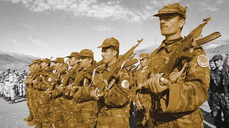 Iraqi Kurdish peshmerga, or volunteer fighters, march during training session in Kurdistan Democratic Party (KDP)-controlled Arbil. AFP
