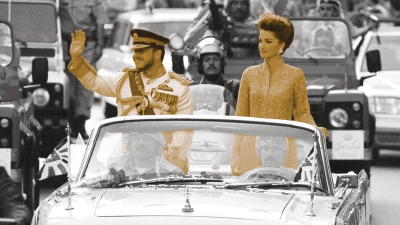 King Abdullah and Queen Rania at his investiture parade. Getty Images