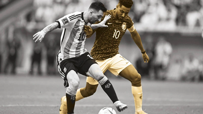 Salem Al-Dawsari battles with Messi during the Green Falcons’ historic 2-1 first round win. AFP