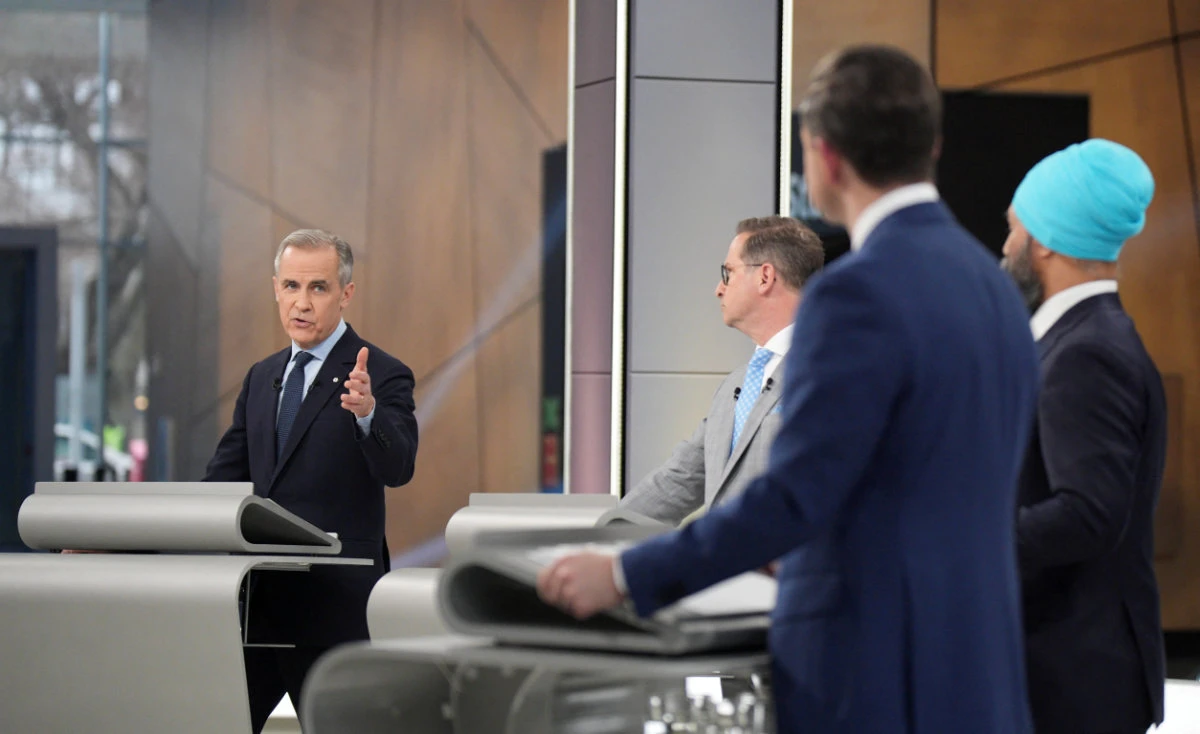 Canadian Prime Minister Mark Carney, the Liberal Party leader, debates with Conservative leader Pierre Poilievre, Bloc Quebecois leader Yves-Francois Blanchet and New Democratic Party leader Jagmeet Singh during the French-language federal leaders' debate in Montreal, Quebec, Canada, on April 16, 2025. (Pool via REUTERS)