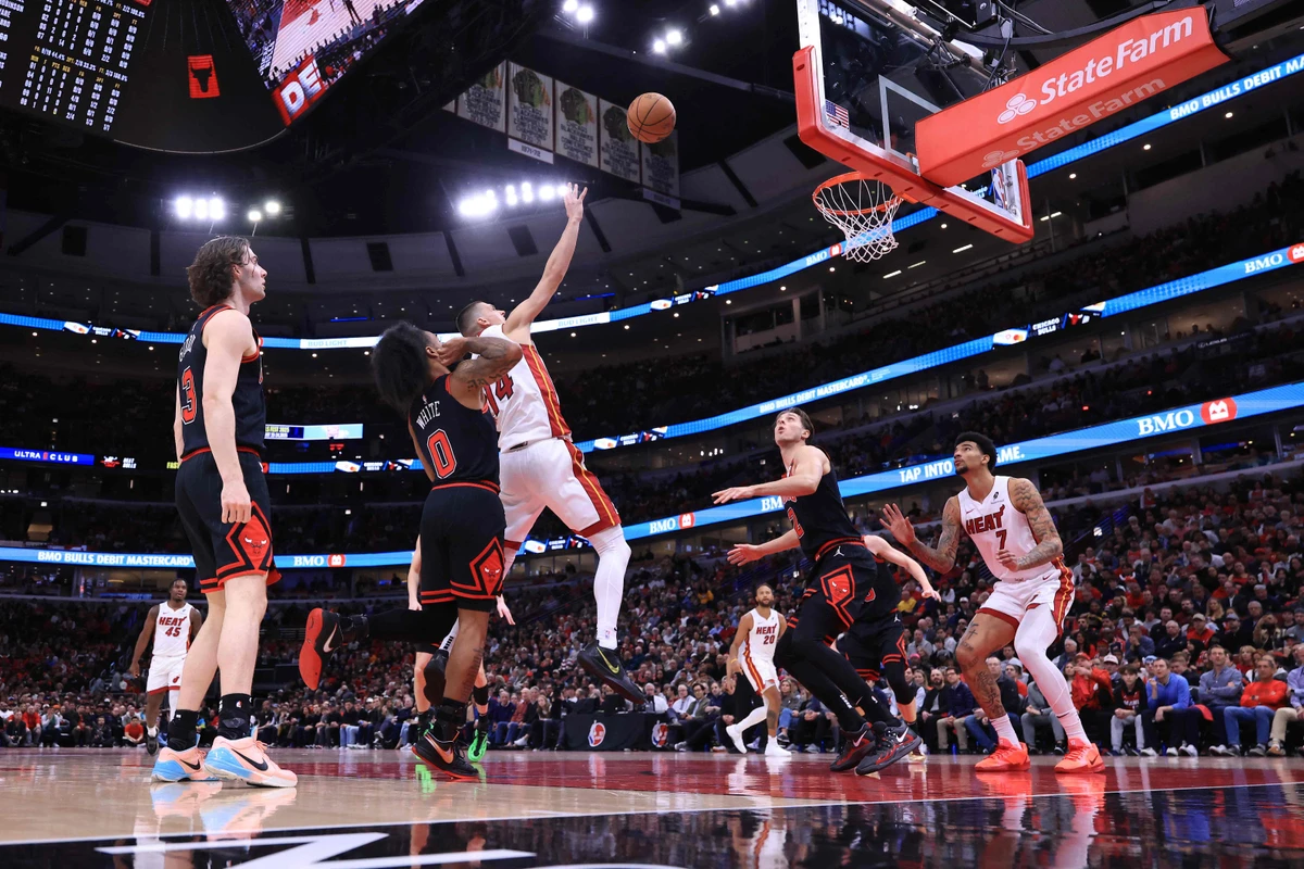 Tyler Herro of the Miami Heat takes a shot over Coby White of the Chicago Bulls during the first half of the Play-In Tournament at the United Center on Wednesday in Chicago. (
