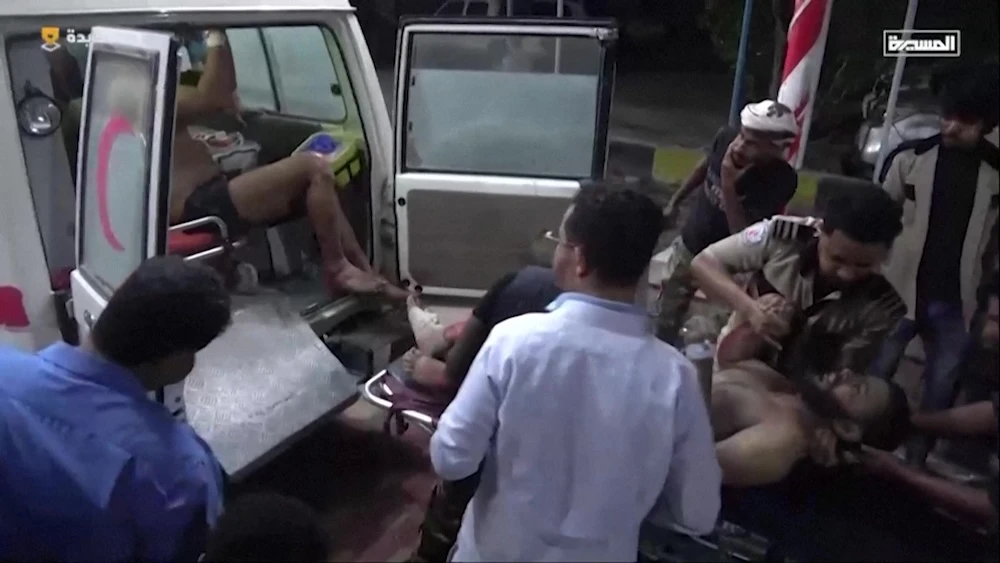 This grab taken from footage released by Al Masirah TV station shows injured persons arriving by ambulance at a hospital following US air strikes in western Yemen on April 18, 2025. (Al Masirah/AFP)