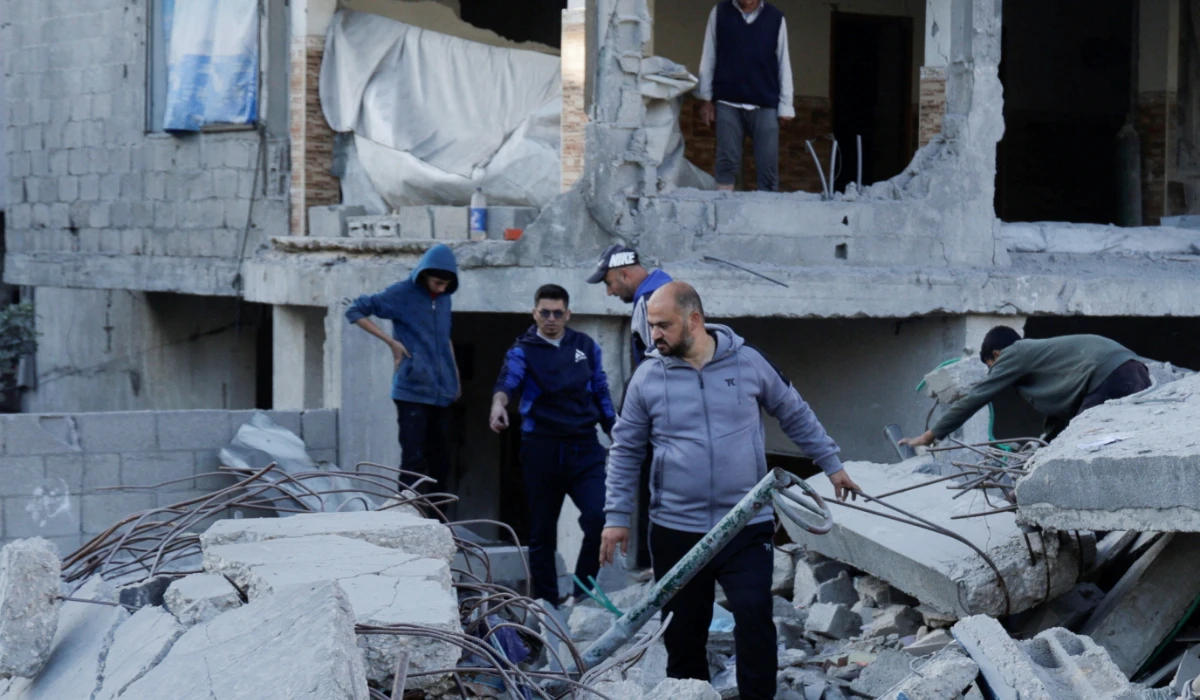 Palestinians gather at the site of an Israeli strike on a house, in Khan Younis in the southern Gaza Strip April 19, 2025. (REUTERS)