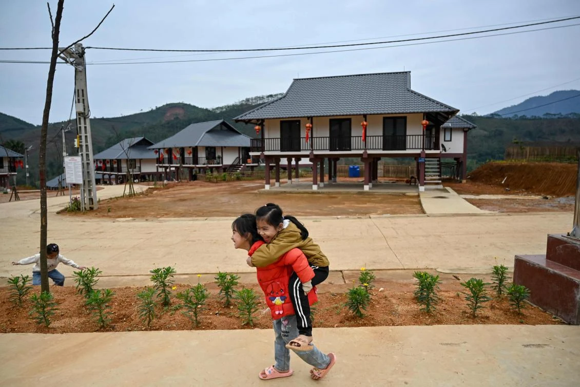 Above, the new site of Lang Nu village in mountainous Lao Cai province after the old one was devastated by Typhoon Yagi last year. (AFP)