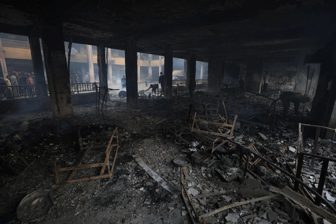 Palestinians inspect the damage at a school sheltering displaced people following an Israeli strike in Gaza City on April 23, 2025. (Reuters)