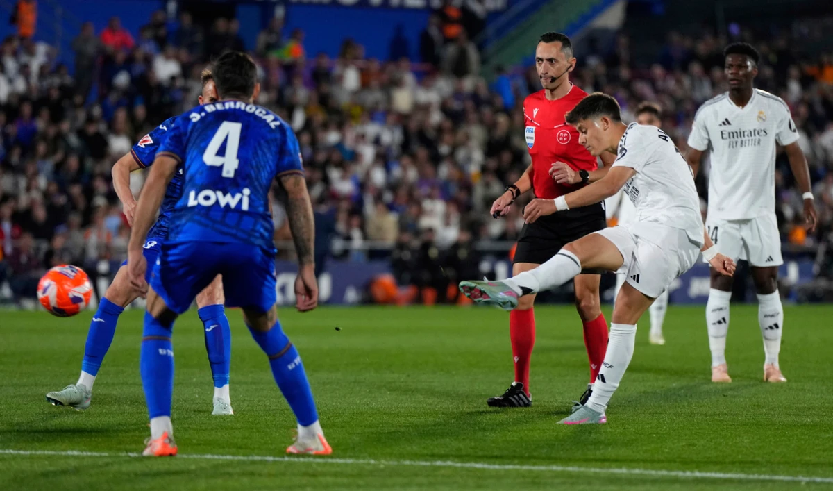 Real Madrid’s Arda Guler scores his side’s opening goal during a Spanish La Liga football match between Getafe and Real Madrid at the Coliseum Alfonso Perez stadium in Getafe, Spain, Wednesday. (AP)
